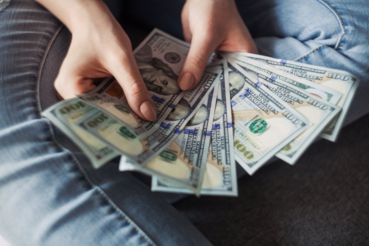 person holding dollars